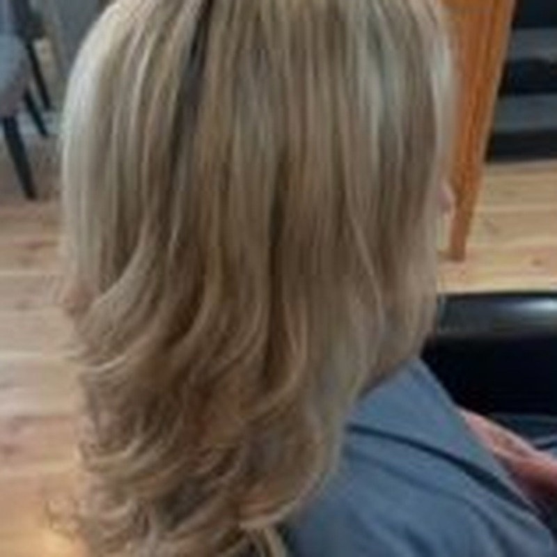 Soft blonde balayage with layered waves
