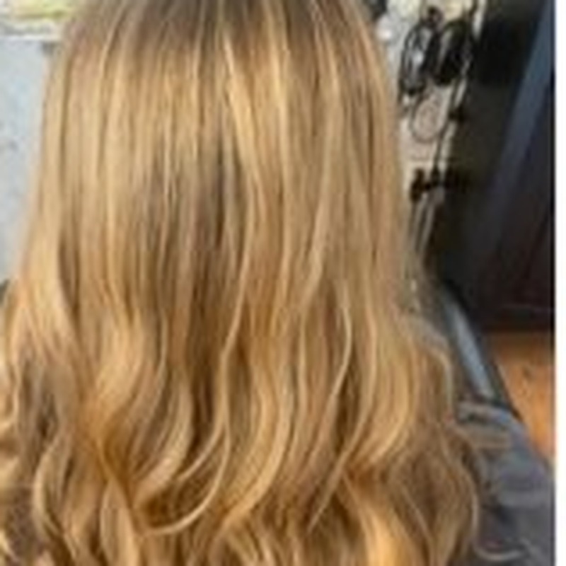 Warm honey blonde color and styling
